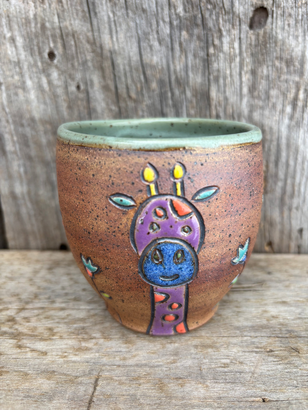 Giraffe and Lion cup